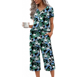 image:imageEkouaer Womens Pajama Sets Short Sleeve Sleepwear Button Up Pj Loungewear Top and Capri Pants with PocketsBlack and Blue Floral